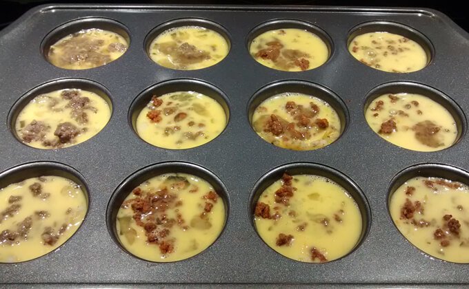 breakfast casserole muffins - pour beaten eggs on top of the filling mixture